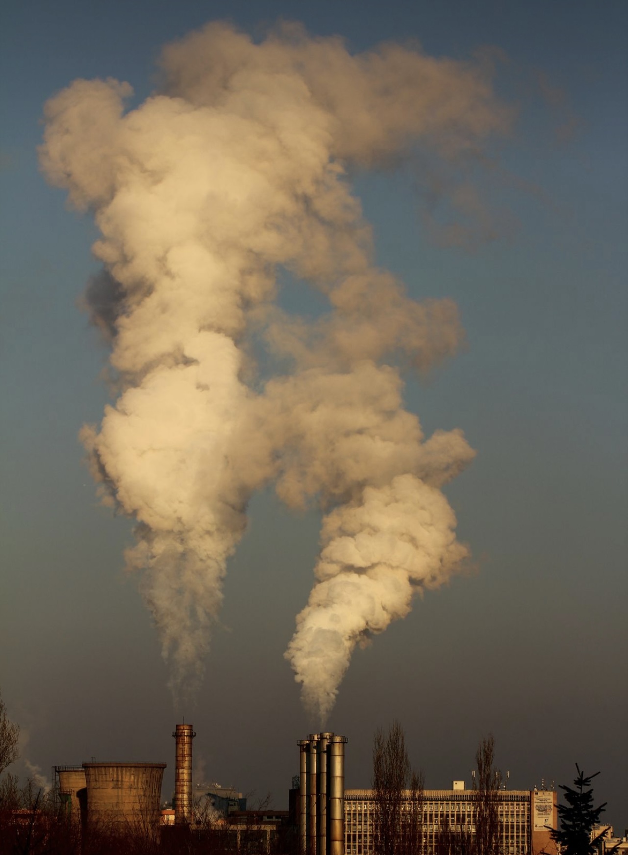 Pictures of smoke billowing out of a smoke stack.